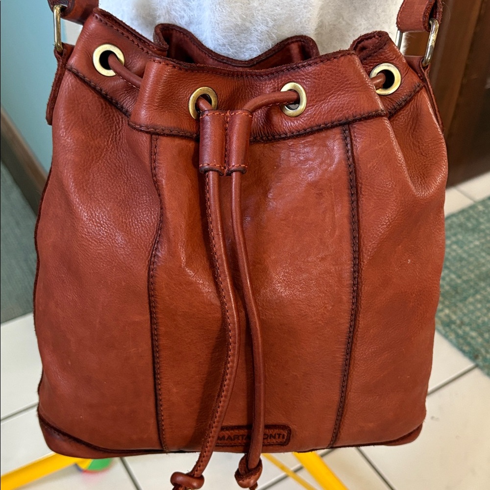 Marta Ponti  Shoulder/ Crossbody bucket bag/drawstring Soft leather cognac brow